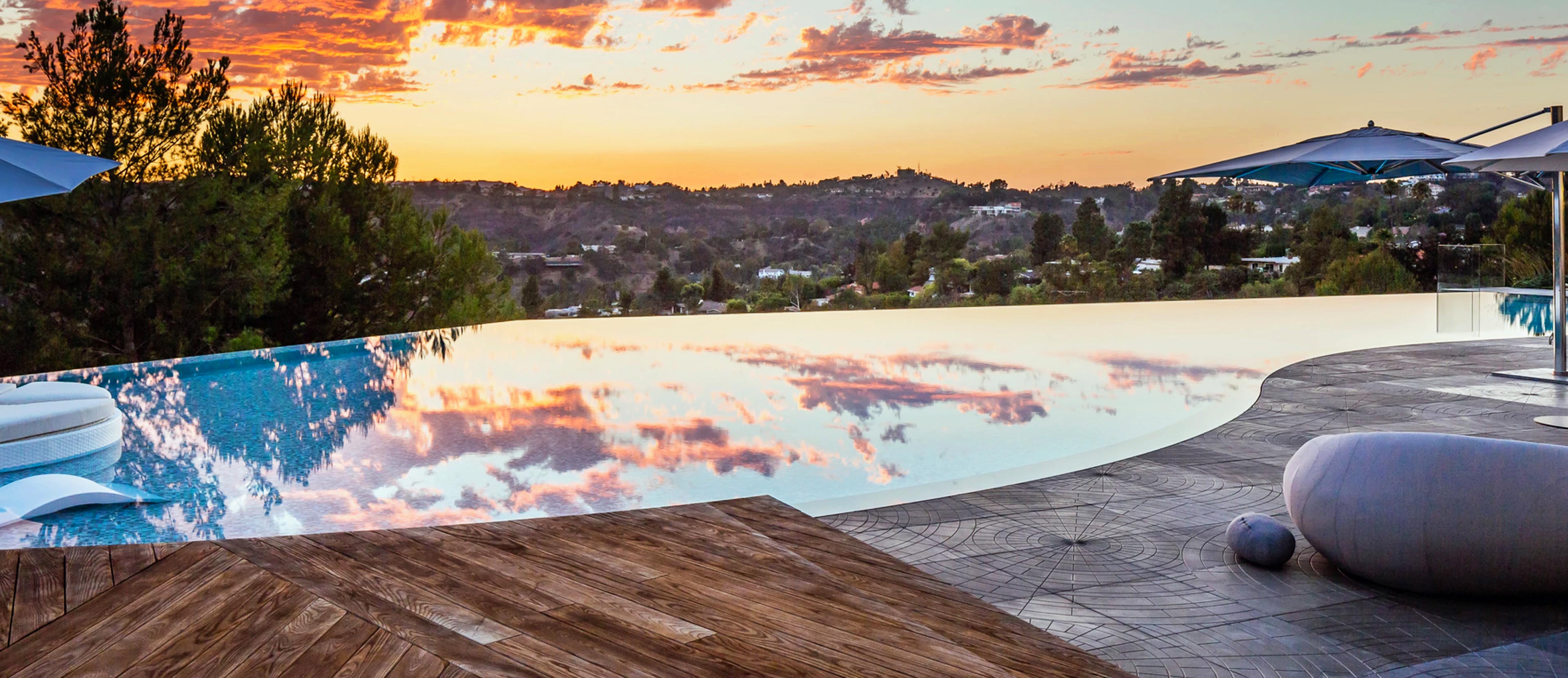 Horizon Pool at Sunset with Rock Art Features