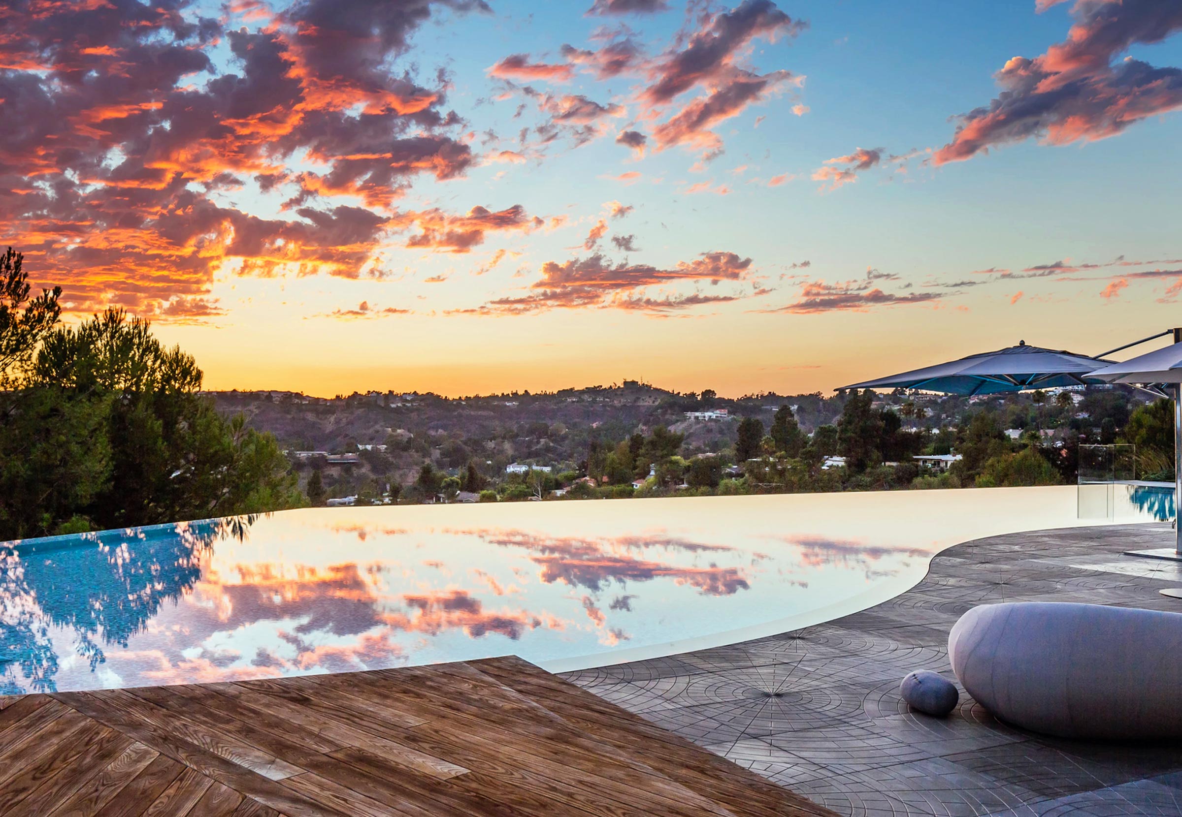 Horizon Pool at Sunset with Rock Art Features Medium