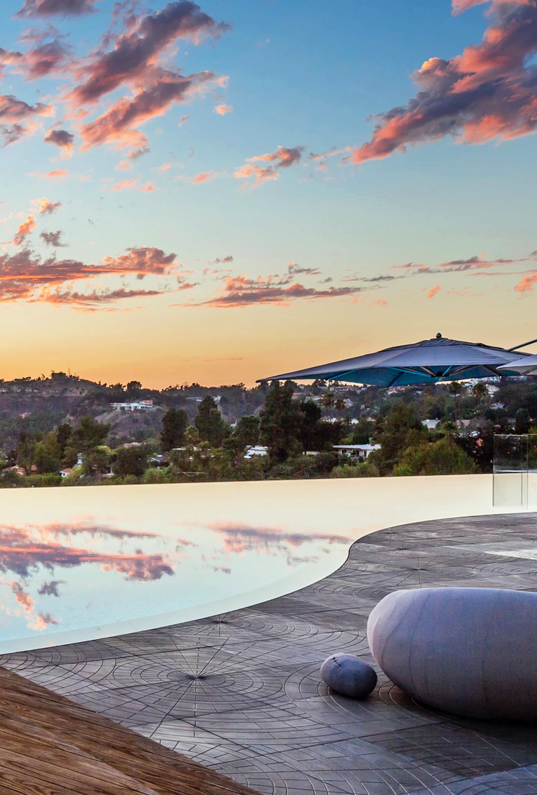 Horizon Pool at Sunset with Rock Art Features Small